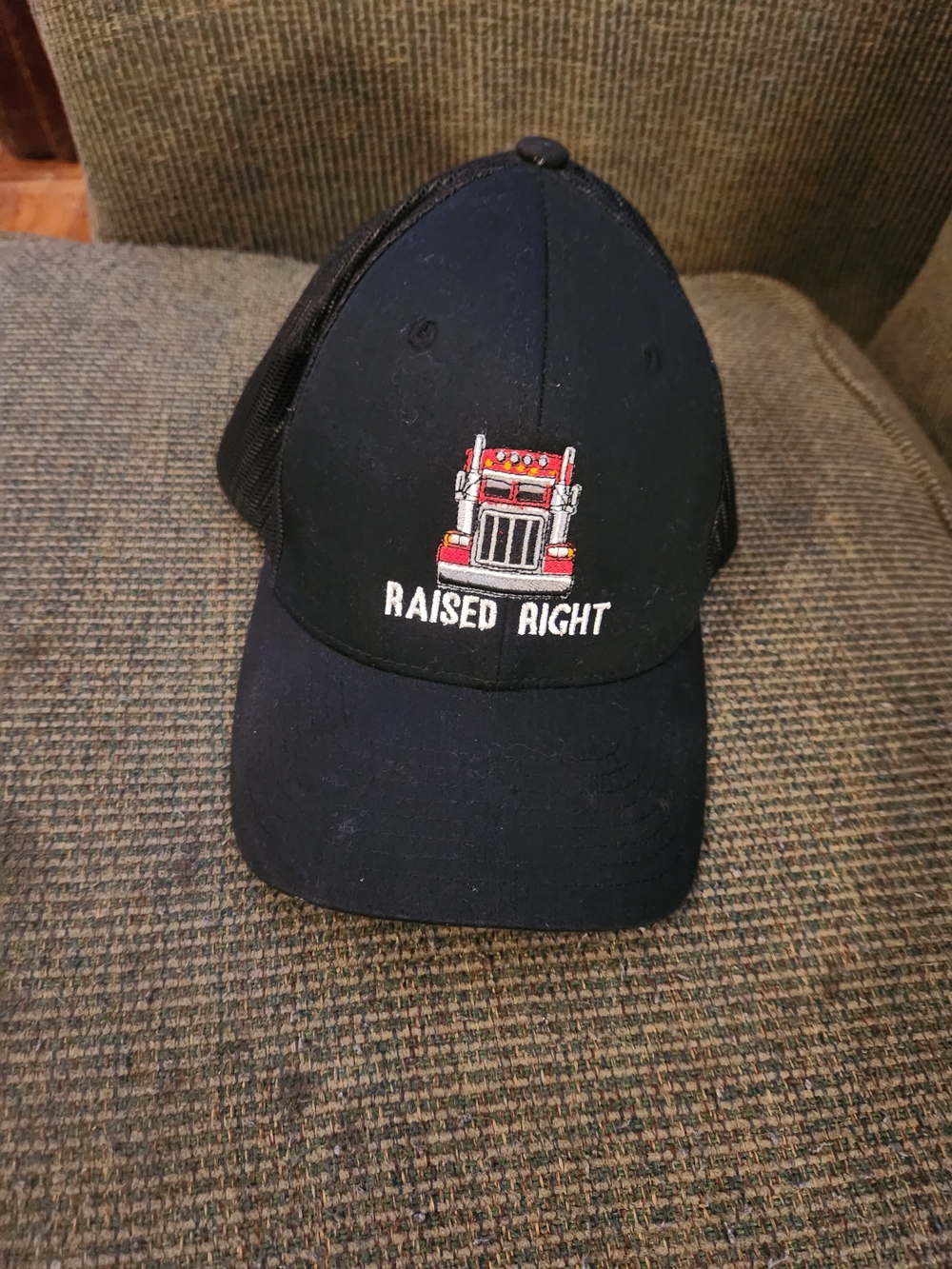 "Raised Right" Embroidered Black Trucker Cap